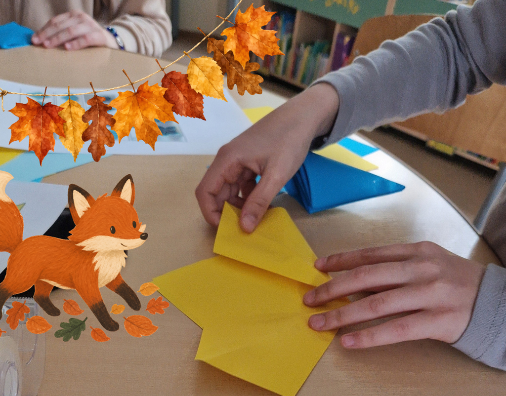 Bērna rokas locī dzeltenu papīru bibliotēkas radošajā darbnīcā ar rudens tematiku